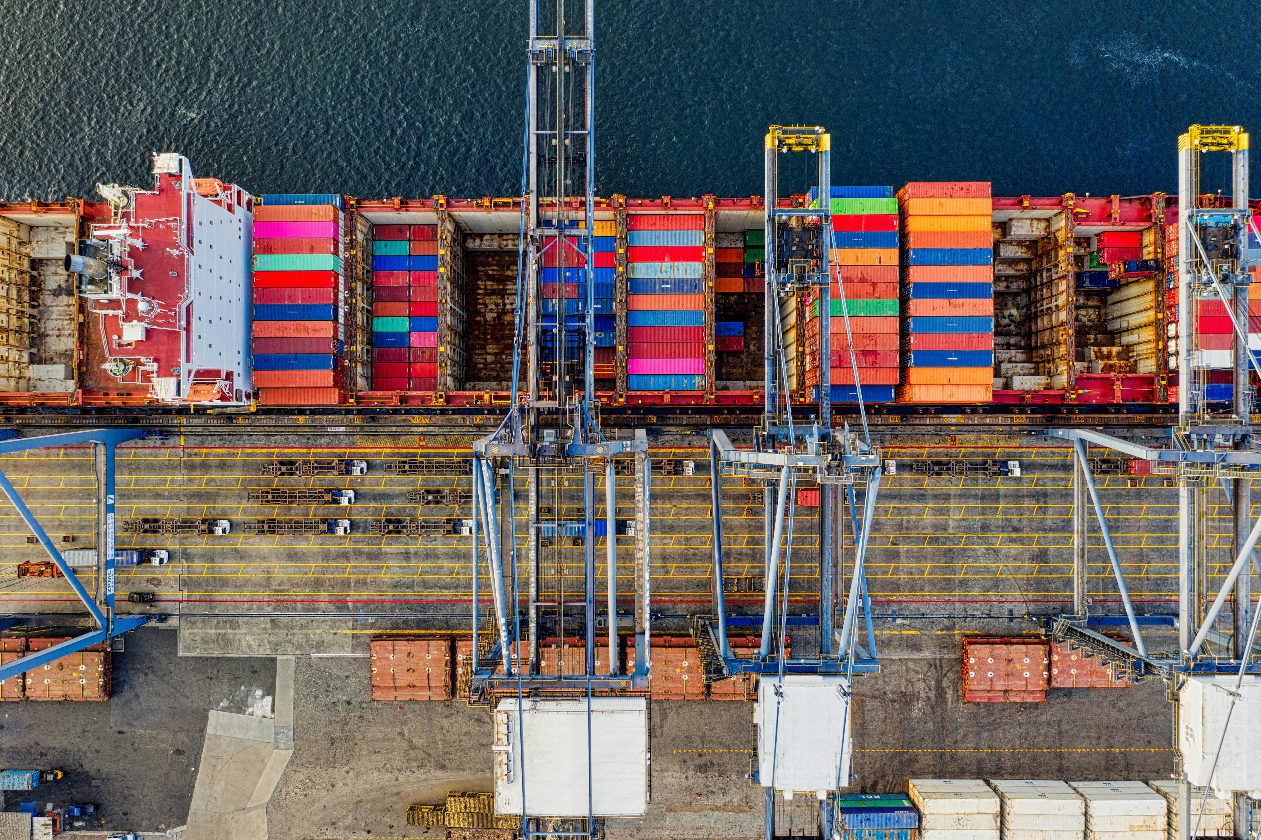pexels-photo-3057963-3057963 Aerial view of colorful cargo containers at a bustling port in Jakarta, Indonesia.
